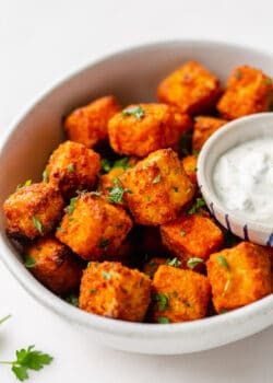 buffalo tofu in a bowl with parsley on top