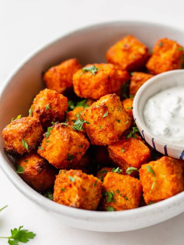 buffalo tofu in a bowl with parsley on top