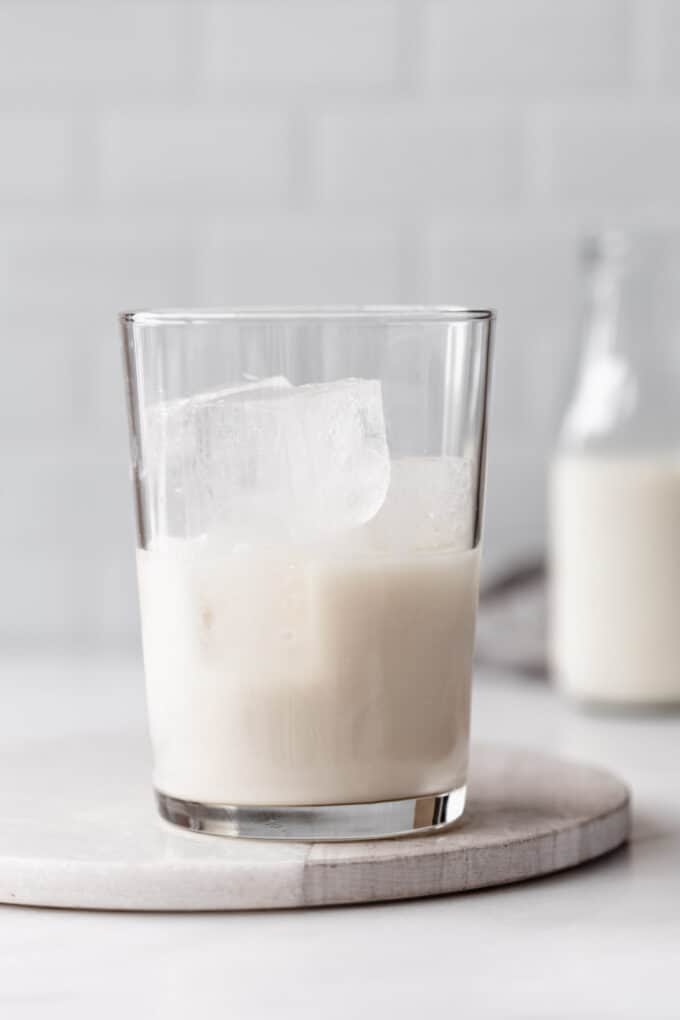 oat milk in a glass with ice