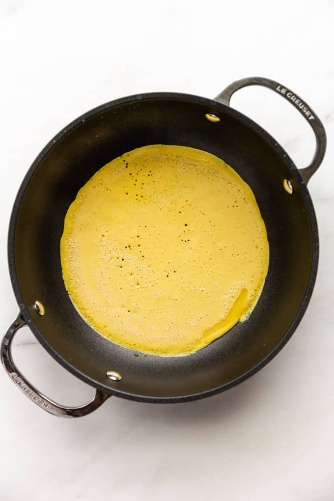 chickpea flour omlette batter in a pan