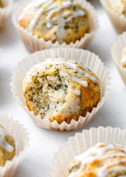 a lemon poppyseed muffin with a bite taken out of it