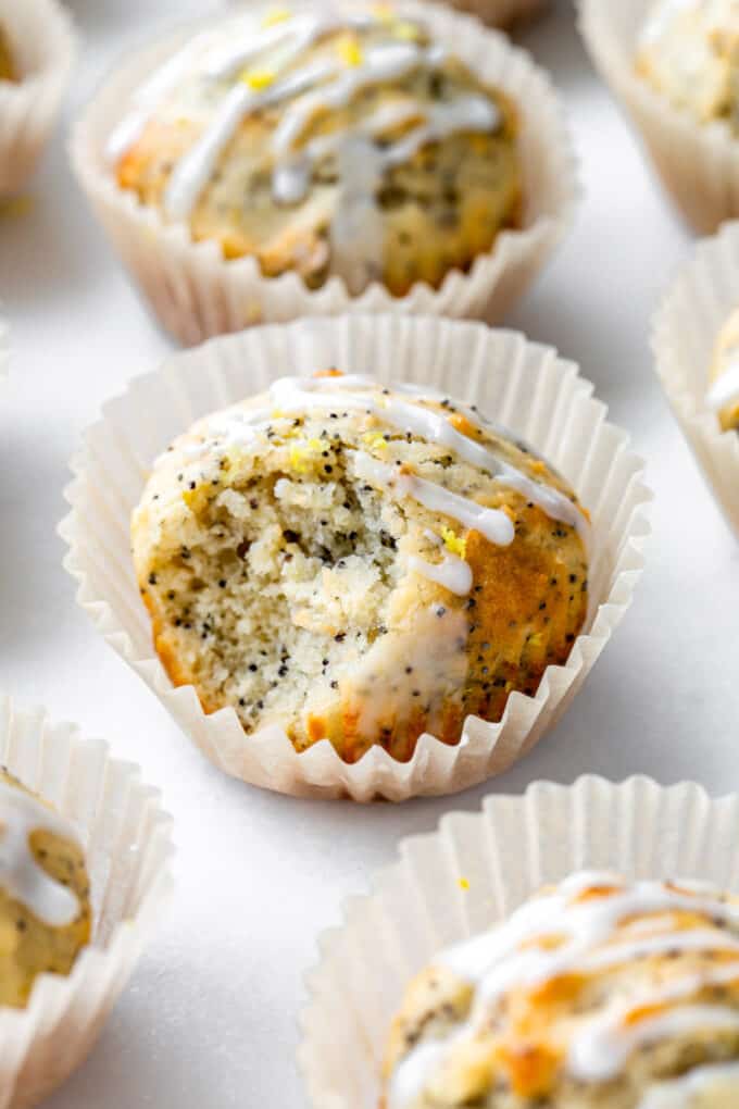 a lemon poppy seed muffin with a bite taken out of it