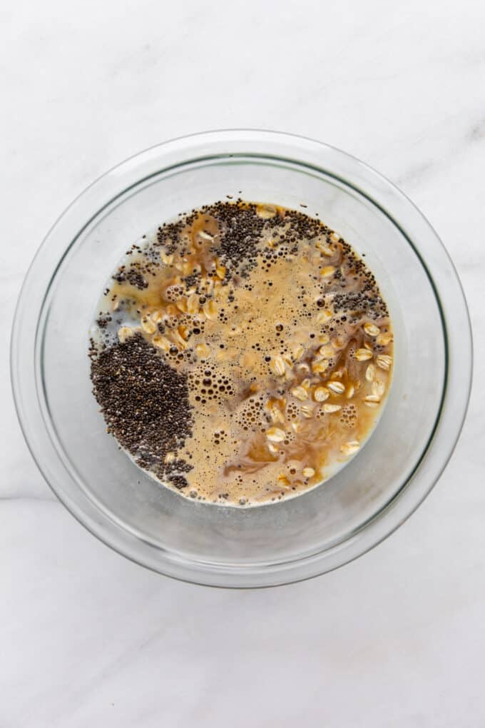 oats, chia seeds, espresso, chia seeds and almond milk in a mixing bowl