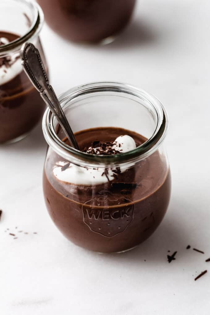 vegan chocolate pudding in a cup with a spoon