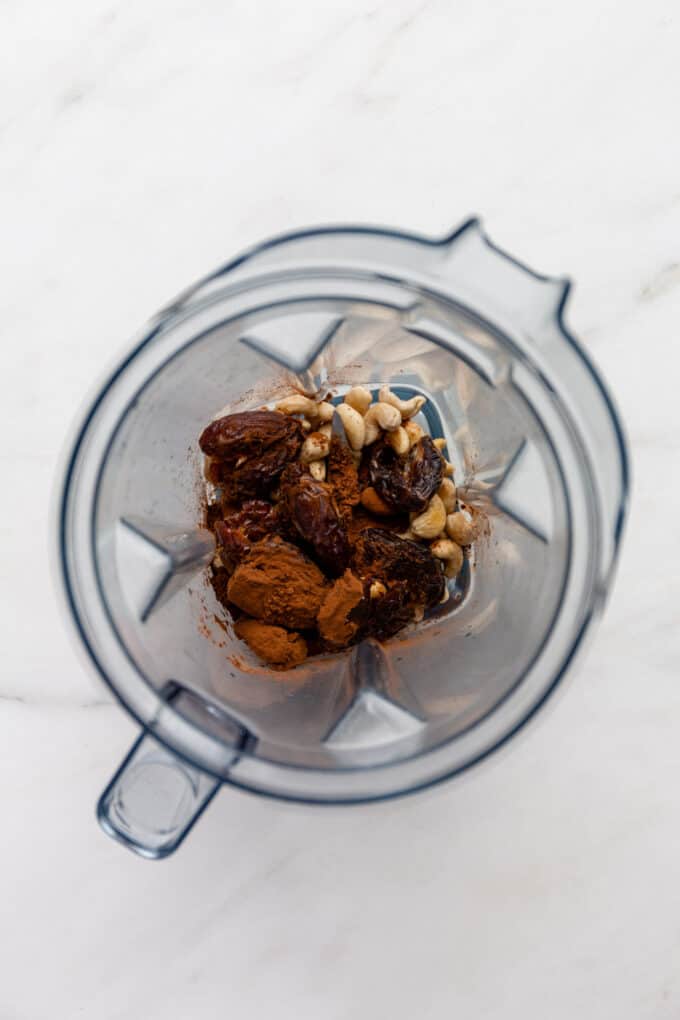 dates, cashews and cocoa powder in a blender