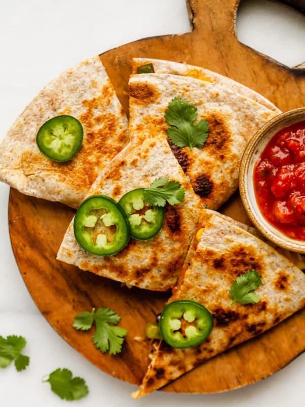 veggie quesadillas cut up on a wood board
