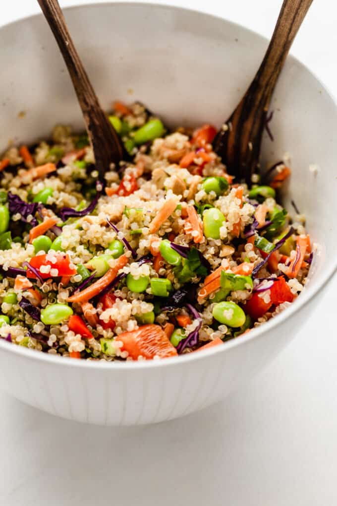 a mixing bowl with edamame and quinoa salad