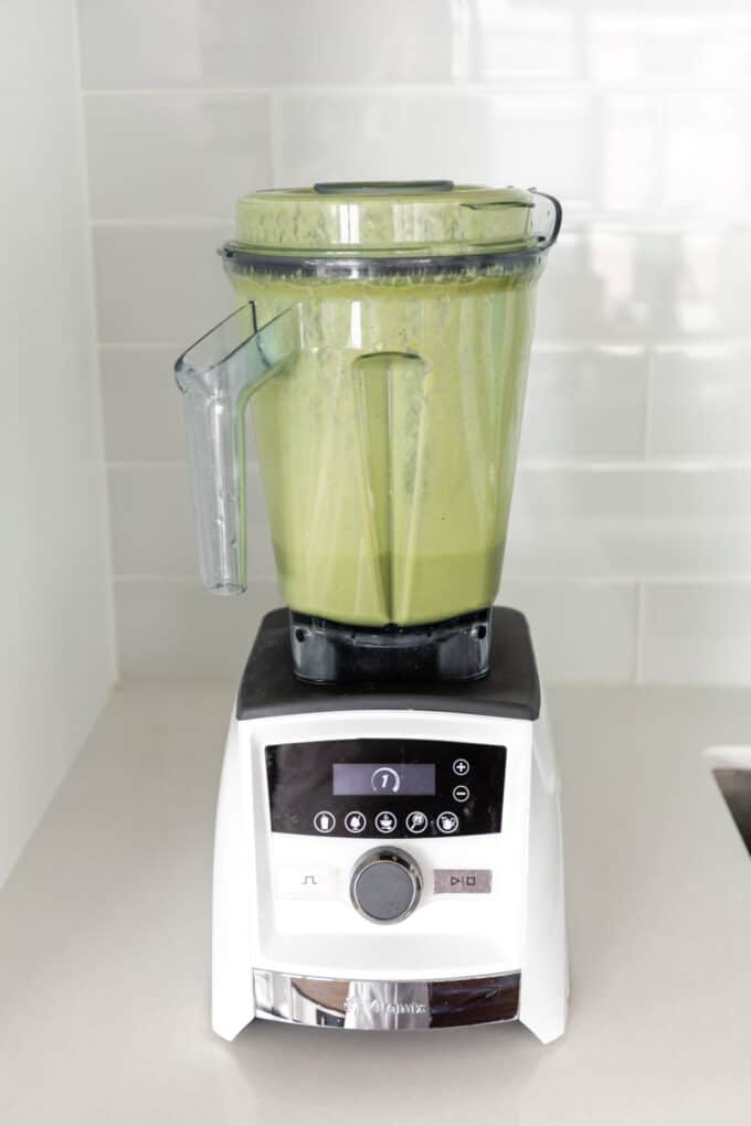 a green protein smoothie in a blender
