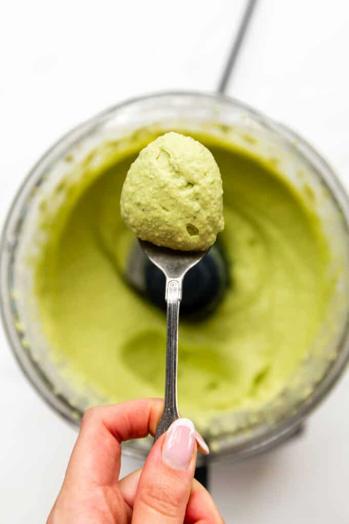 green pea hummus on a spoon