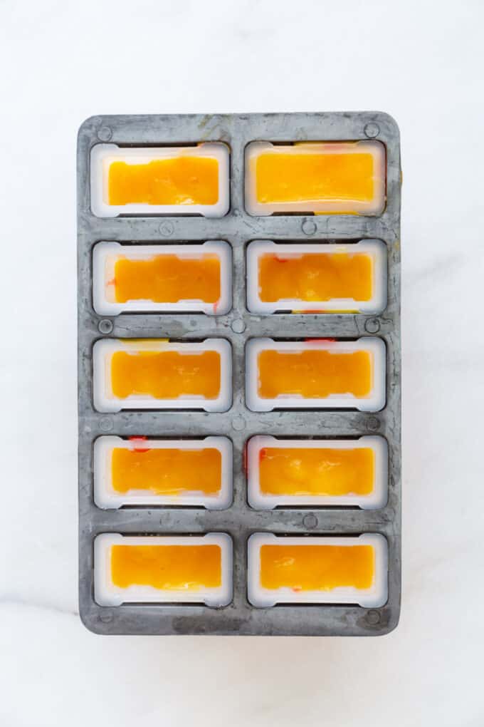 mango puree in a popsicle mold