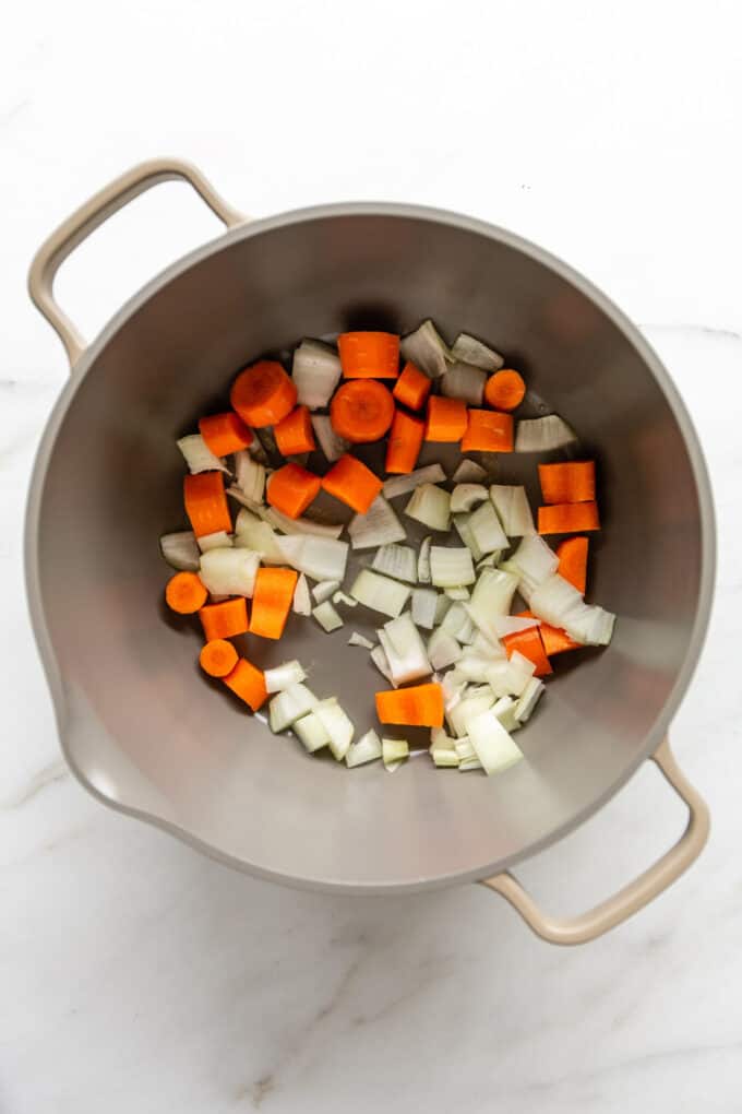 onions, garlic and carrots in a large pot
