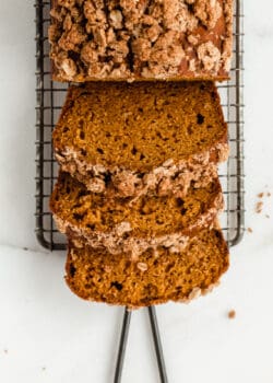 three slices of pumpkin banana bread with streusel topping