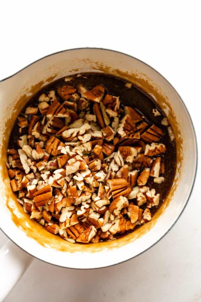 pecans and melted sugar and oil in a pot