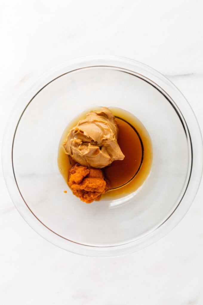 maple syrup, almond butter and pumpkin puree in a mixing bowl