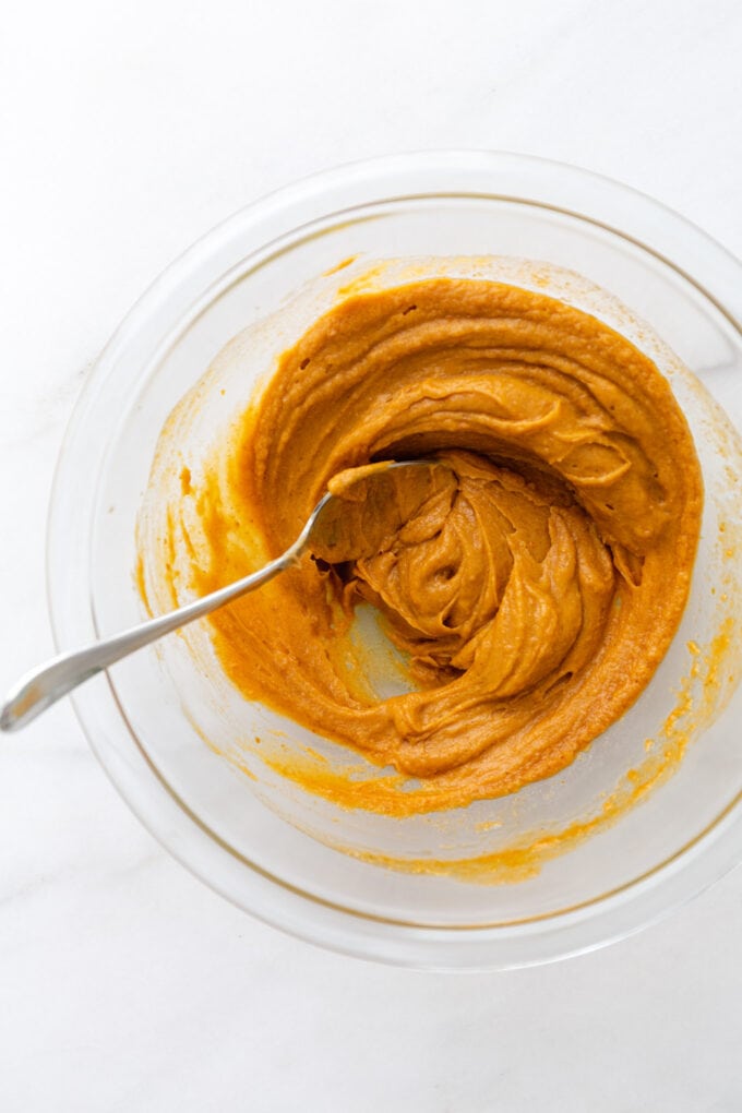 mixed up pumpkin puree and almond butter in a mixing bowl