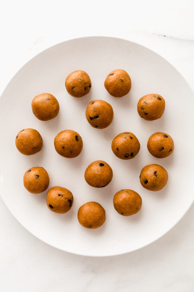 pumpkin protein balls on a white plate