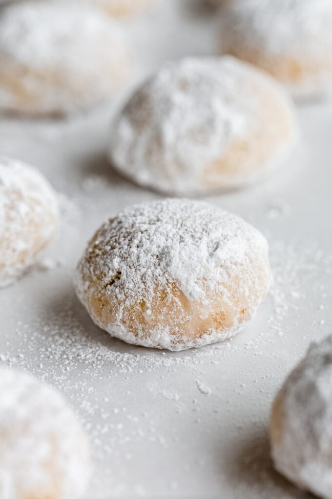 an almond snowball cookie with powdered sugar on it