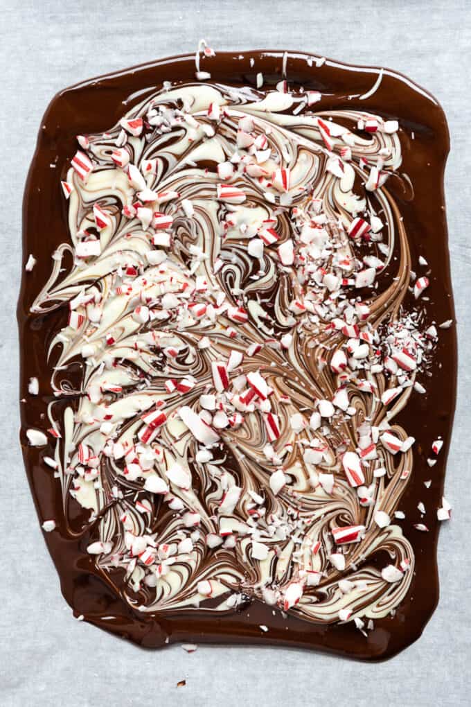 melted dark and white chocolate bark with crushed candy canes on top