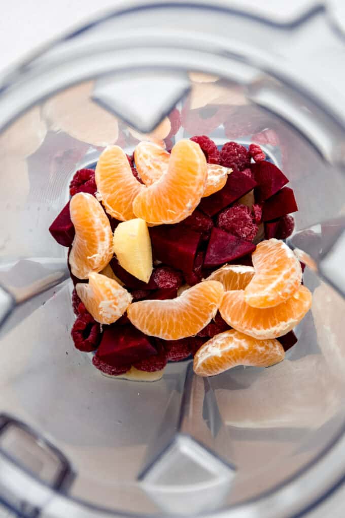 beets, raspberries and mandarin in a blender
