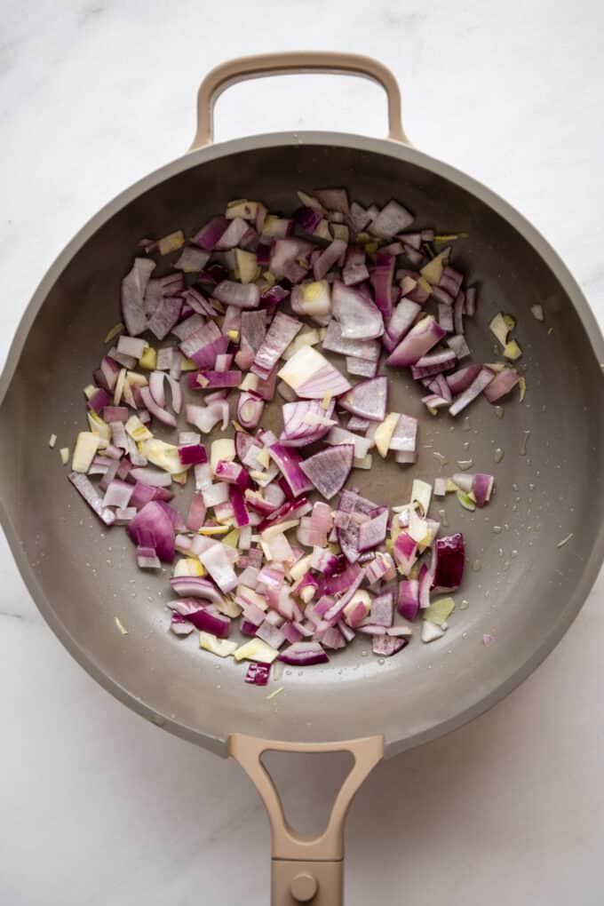 sauteed onions, garlic and ginger in a pan
