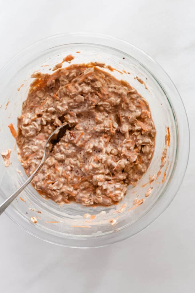 carrot cake overnight oats in a mixing bowl