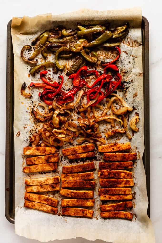 tofu, peppers and onion baked on a baking sheet