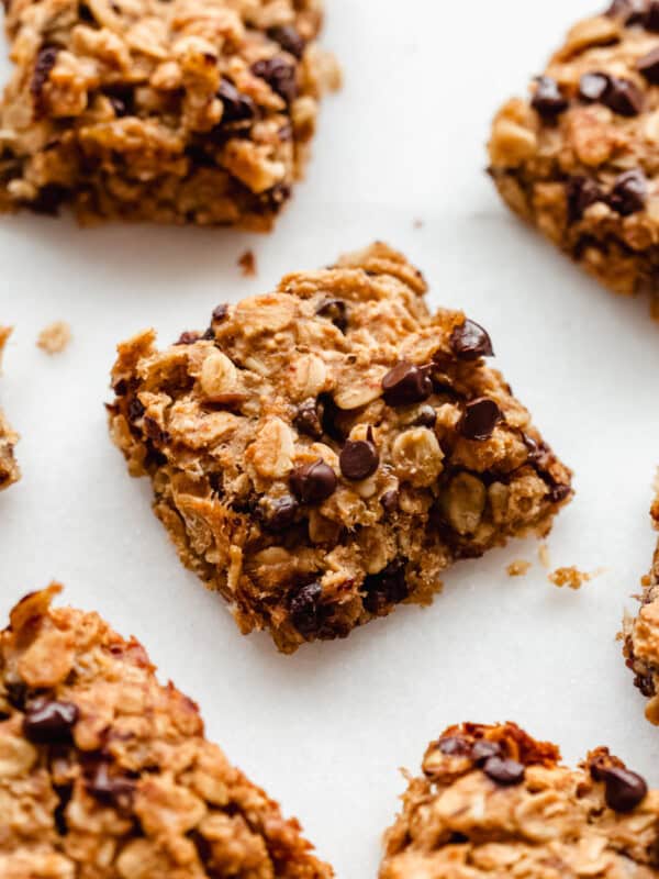 banana oatmeal bars sliced into squares topped with chocolate chips