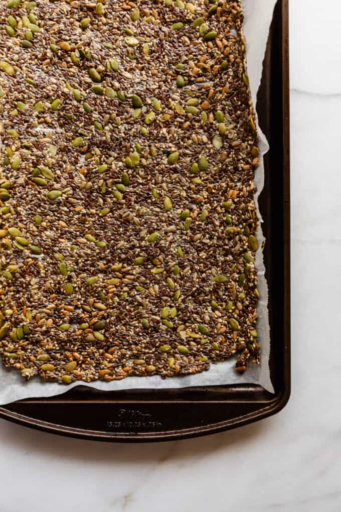 baked flax crackers on a baking sheet