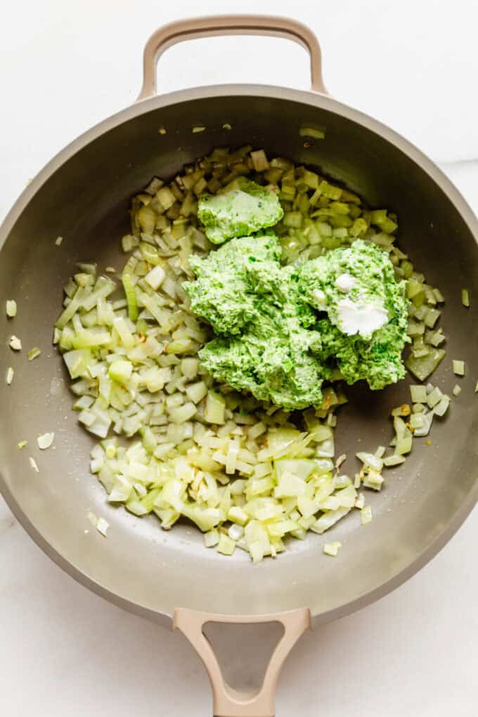 onion, garlic and ricotta pea mixture in a pan