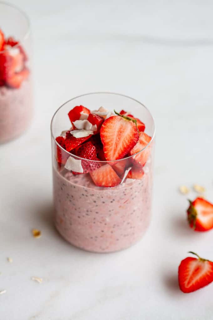 strawberry overnight oats in a jar on a marble counter
