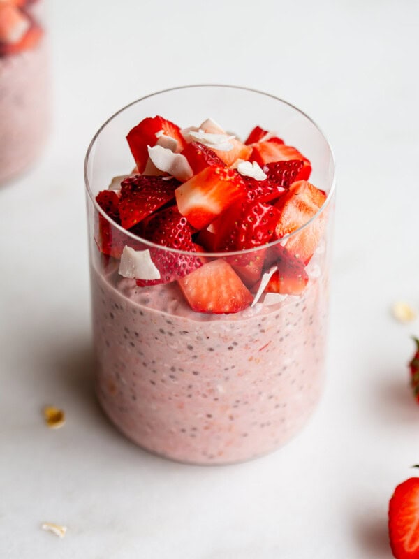 a jar of strawberry overnight oats topped with chopped strawberries