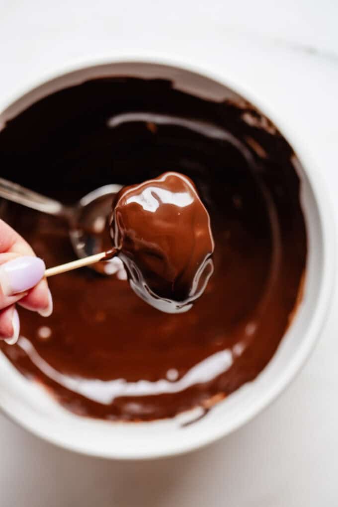 a medjool date covered in dark chocolate