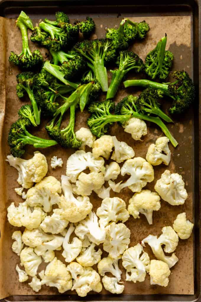 roasted broccoli and cauliflower on a baking sheet