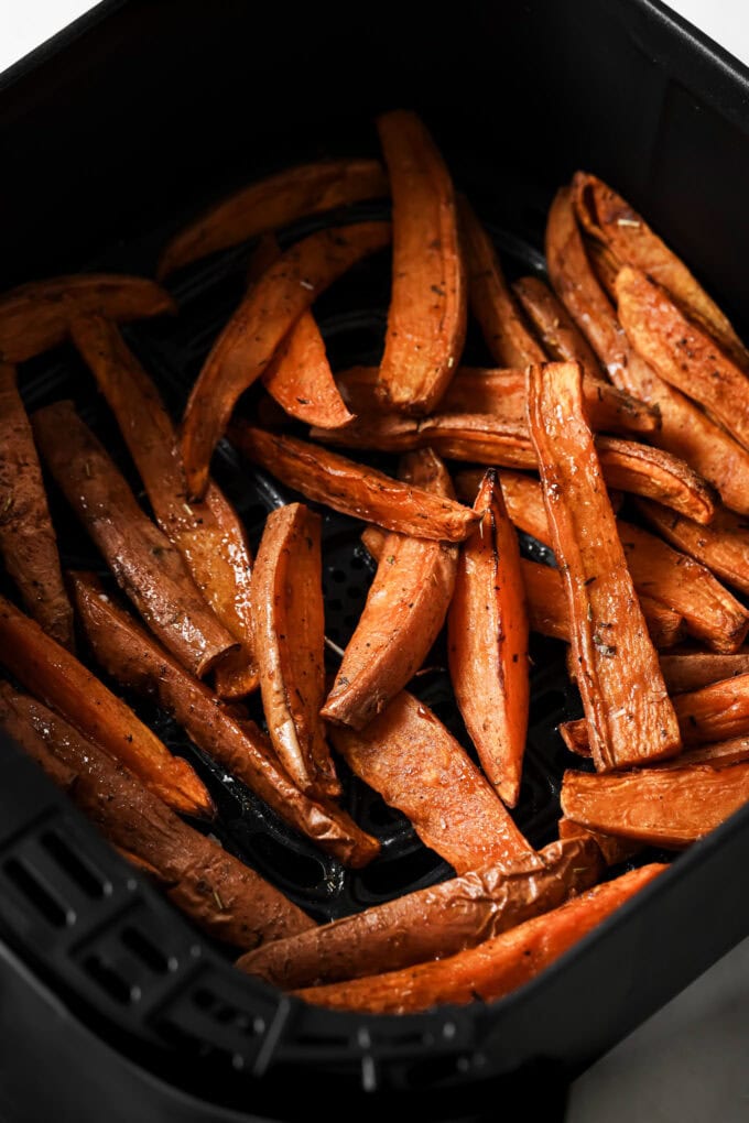 cooked sweet potato wedges in an air fryer