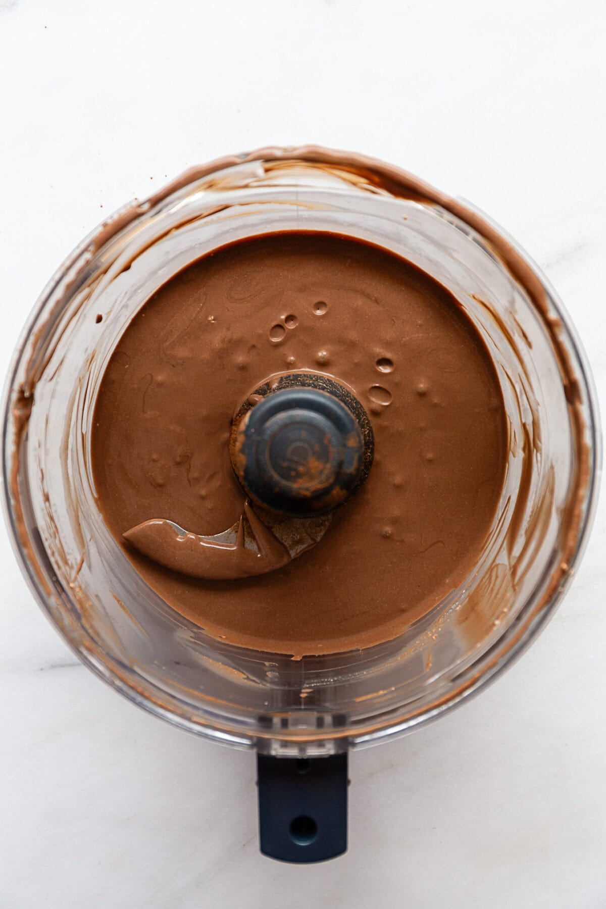 blended cottage cheese, coconut milk, cocoa, maple syrup and vanilla in a food processor.