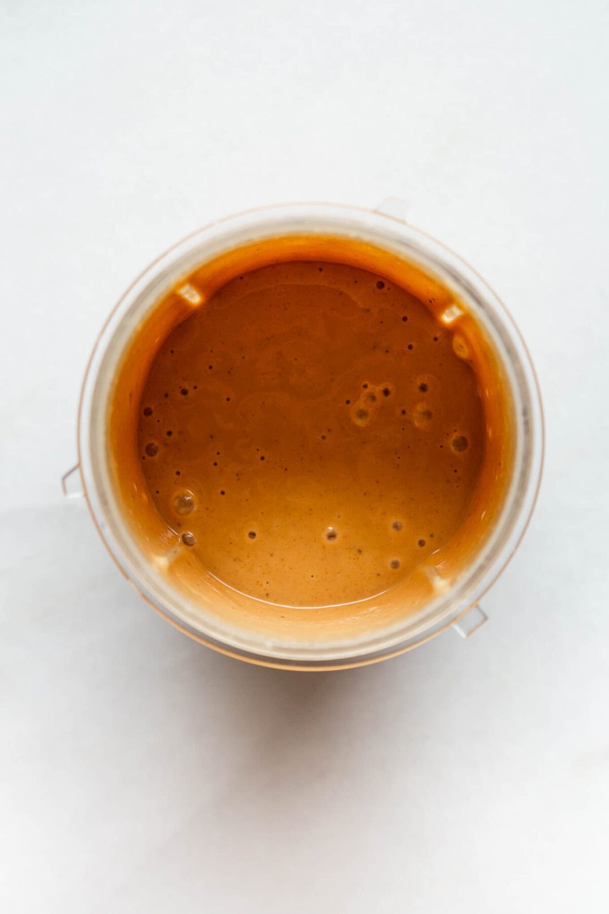 Peanut butter dressing in a magic bullet container.