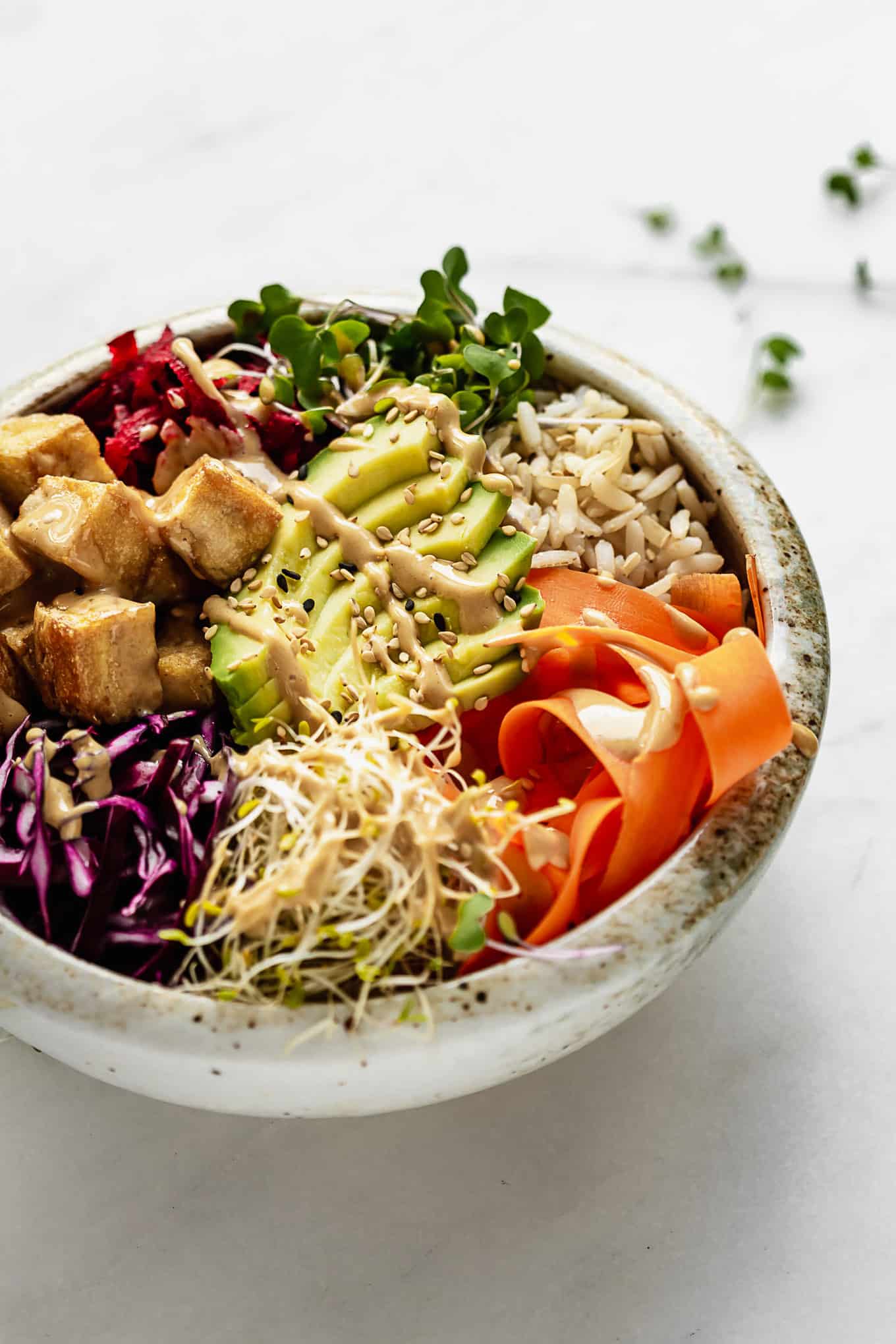 A power bowl with vegetables, tofu, and rice.