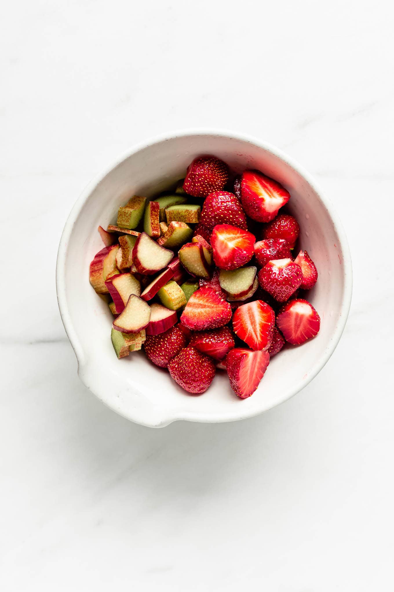 strawberries and rhubarb in a bowl.
