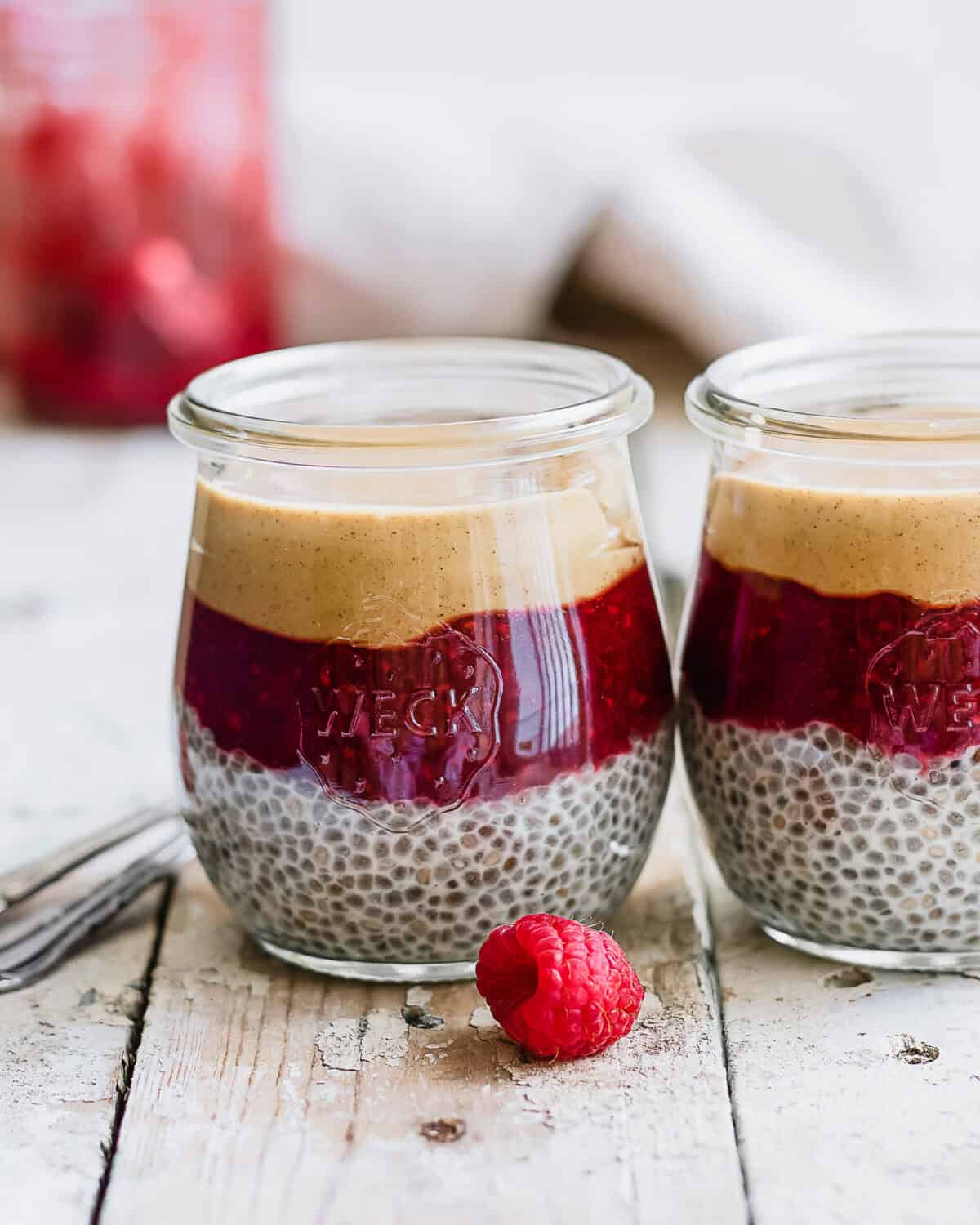 two jars of peanut butter and jelly chia pudding.
