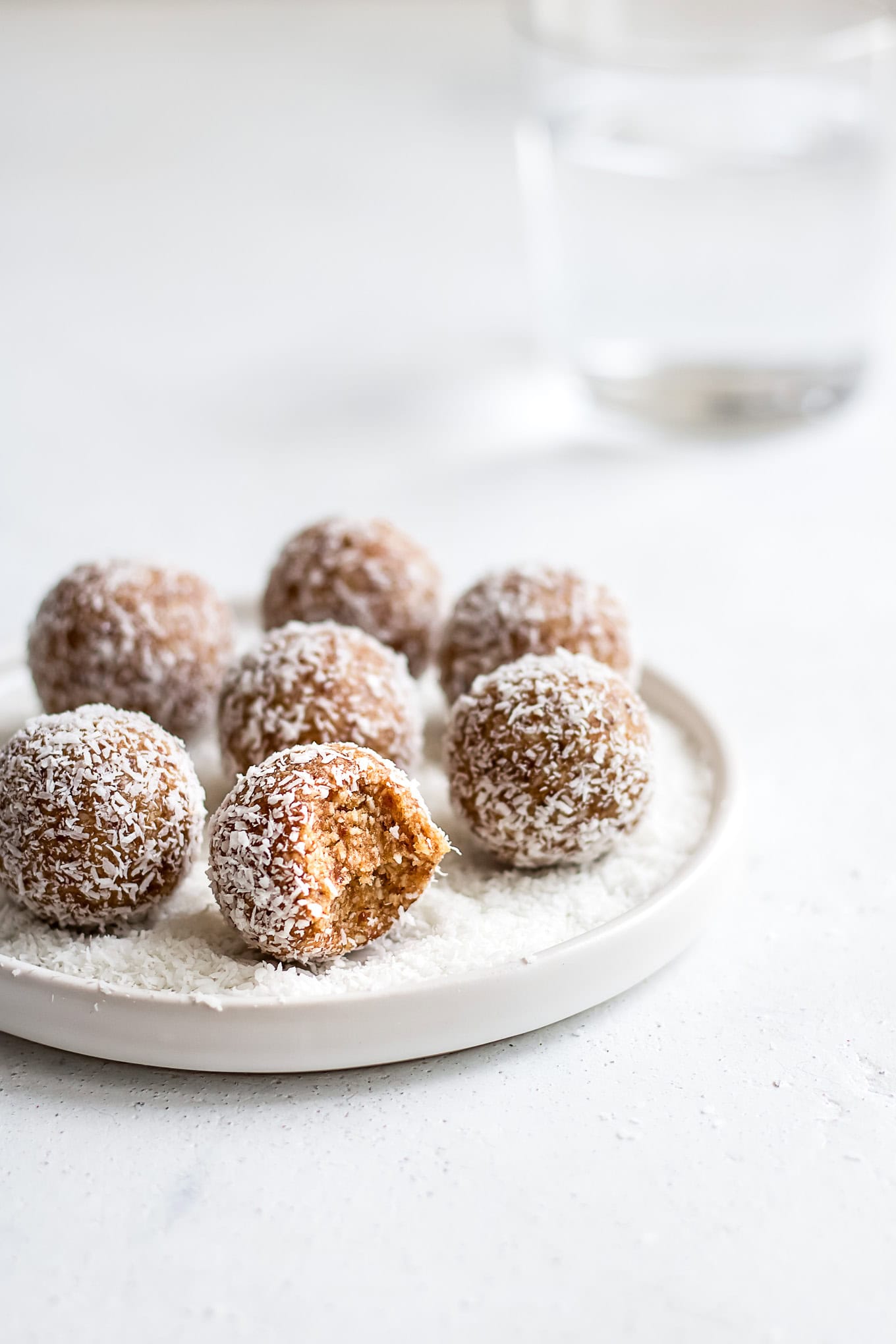 Salted caramel bliss balls on a plate.