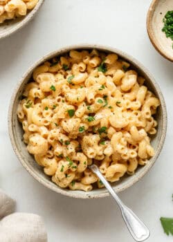 Cottage cheese mac and cheese in a bowl with a napkin on the side.