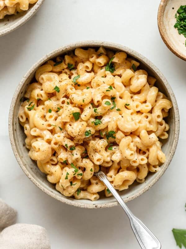 Cottage cheese mac and cheese in a bowl with a napkin on the side.