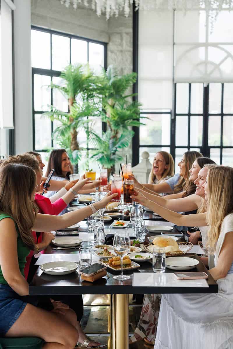 girls toasting at a restaurant.