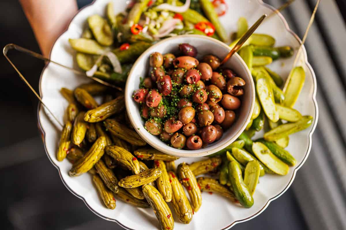 olives and pickles on a plate.