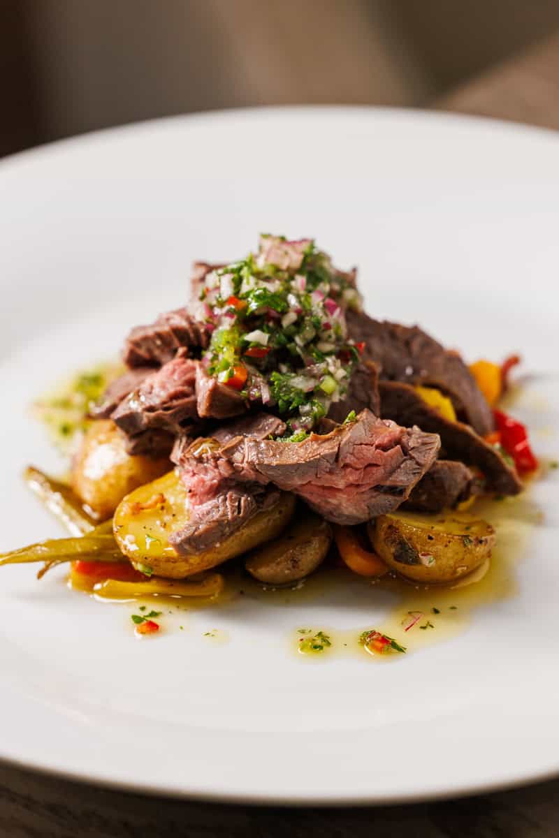 steak and potatoes on a plate.