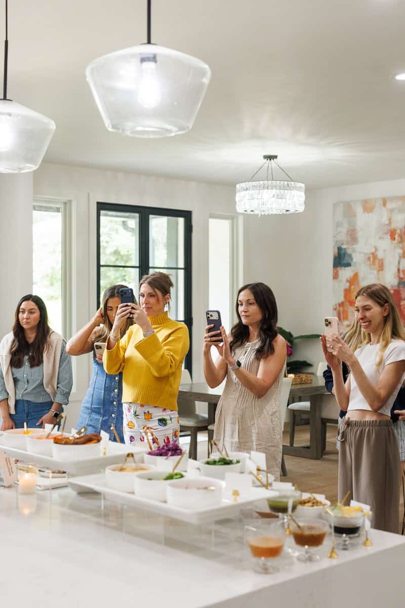 girls taking photos of food.