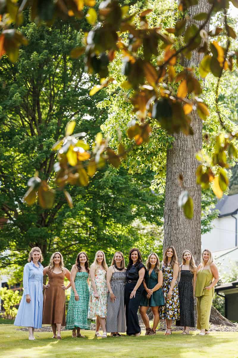 A group of women standing outside.