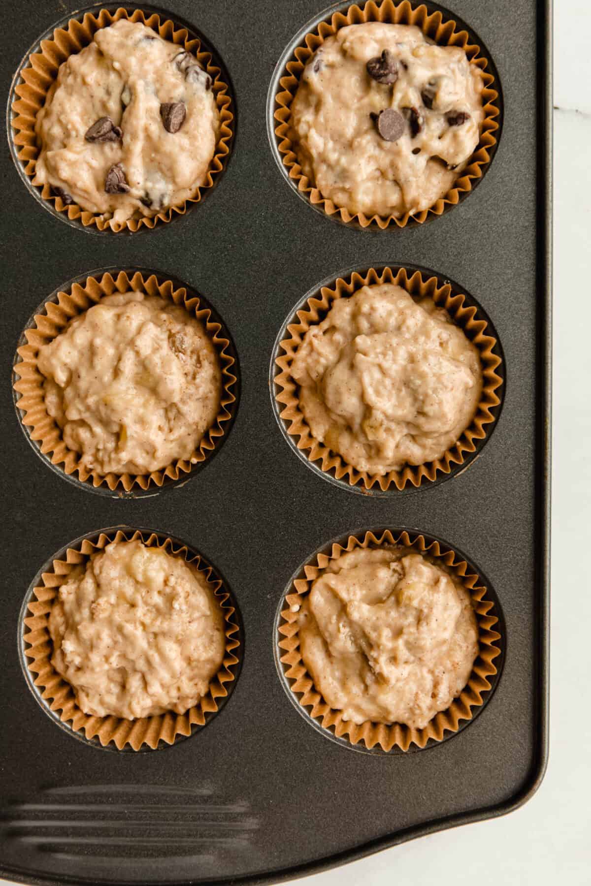 unbaked banana muffins in a muffin pan.