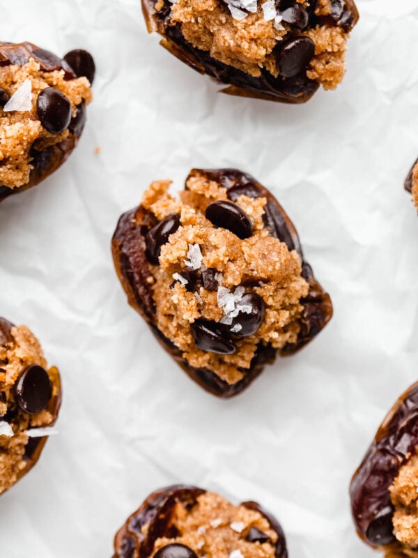 cookie dough stuffed dates in a sheet of parchment paper.