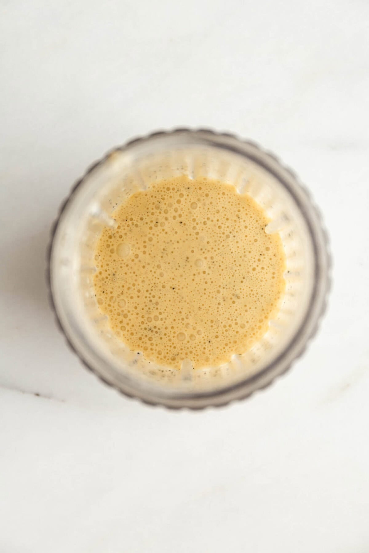 Glass jar of passionfruit chia pudding mixture